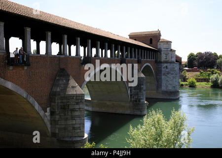 The Ponte Coperto (covered bridge), also known as the Ponte Vecchio (old bridge), a brick and stone arch bridge over the Ticino River in Pavia, Lombar Stock Photo