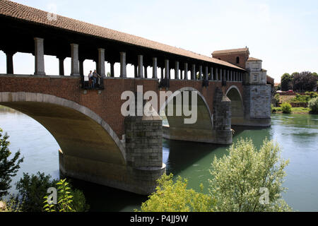 The Ponte Coperto (covered bridge), also known as the Ponte Vecchio (old bridge), a brick and stone arch bridge over the Ticino River in Pavia, Lombar Stock Photo