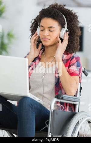beautiful handicaped woman listening to music and relaxing Stock Photo