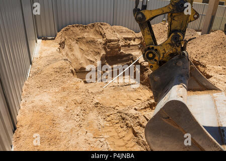 Excavation works for the installation of a swimming pool.Swimming pool under construction. Stock Photo