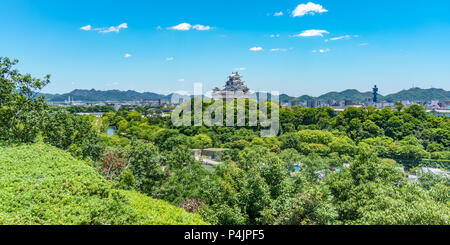 Himeji castle on top of the hill over the city Stock Photo