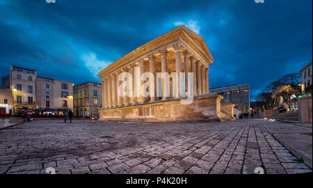 Maison Carree - restored roman temple dedicated to 'princes of youth', with richly decorated columns & friezes in Nimes, France Stock Photo