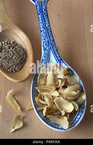 Fried lilly bulbs and spices Stock Photo