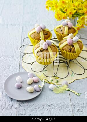 Hot cross muffin topped with chocolate mini eggs Stock Photo