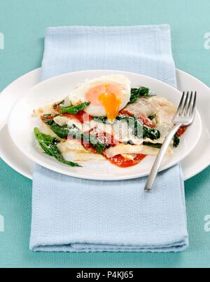 Lasagne di pane carasau (bread bake with fried egg, Italy) Stock Photo