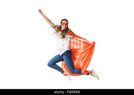 smiling young woman in red cloak and mask flying isolated on white Stock Photo