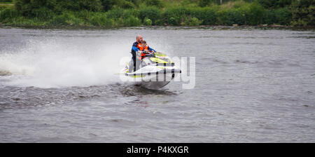 A man and a boy on a Jet Ski on the River Tees at Stockton on Tees,England,UK Stock Photo