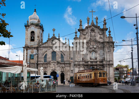 Porto, Portugal - October 10, 2010: Street scene in the city of Porto with an old tram in front of the Carmelitas Church and Carmo Church, in Portugal Stock Photo