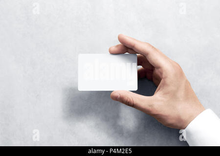 Hand hold blank white card mockup with rounded corners. Plain call-card mock up template holding arm. Plastic credit namecard display front. Check off Stock Photo