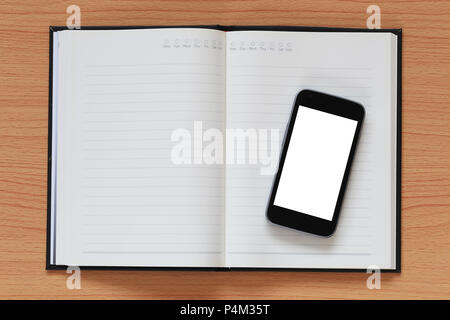 1Empty smartphone on a notebook and have copy space for design in your work concept. Stock Photo