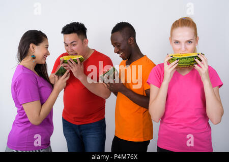 Studio shot of happy teenage girl with diverse group of multi et Stock Photo