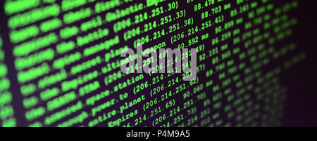 Macro shot of the command line on the monitor of the office computer. The concept of the programmer's work. Information line flow . Stock Photo