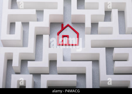 High Angle View Of Red House Symbol In The Centre Of White Maze Stock Photo