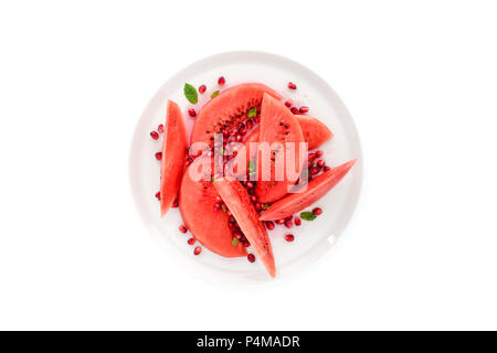 Watermelon salad on a white plate and white background. Stock Photo