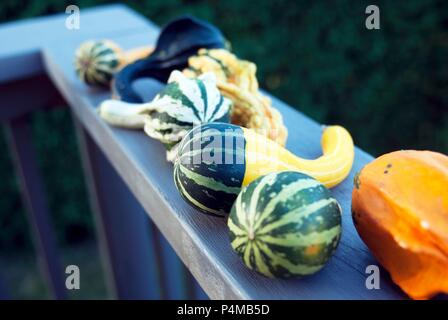 Various types of squash on a balcony ledge Stock Photo