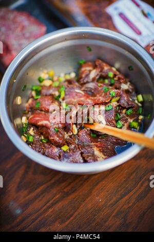 Raw beef in a garlic marinade Stock Photo