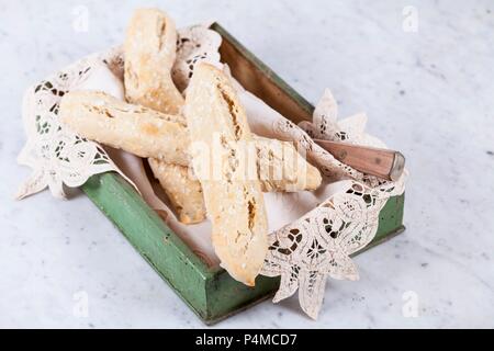 Spelt salt sticks in a wooden box with a doily Stock Photo