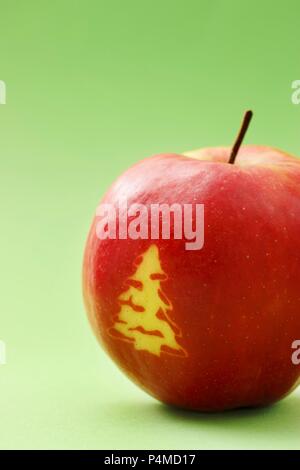 Red apple with a Christmas tree Stock Photo