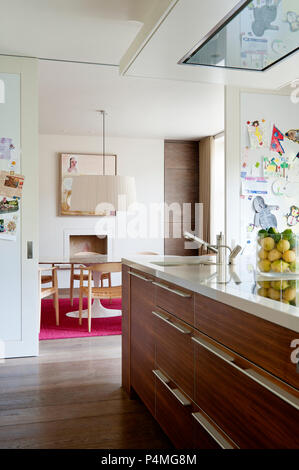 Modern kitchen with sliding doors to dining room Stock Photo