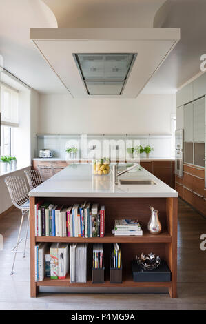 Modern kitchen with recessed bookcase Stock Photo