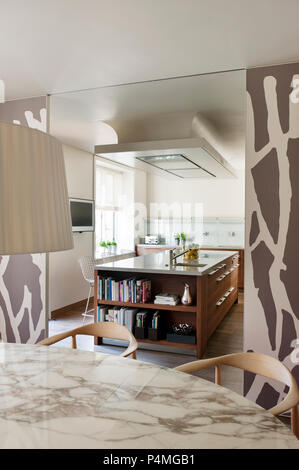 Modern dining room with sliding doors to kitchen Stock Photo