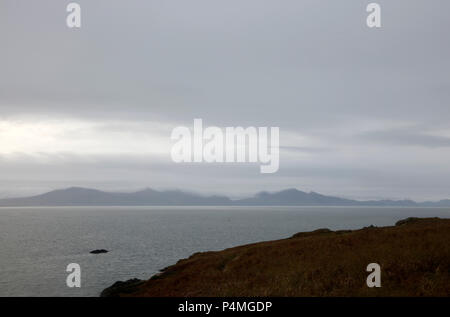 View out from Llanddwyn Island, Angelsey, across Caenarfon Bay to Bwlch Mawr and Yr Eifl on the Lleyn Peninsula, Gwynedd, Wales, UK