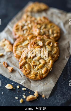 Peanut cookies on baking paper Stock Photo