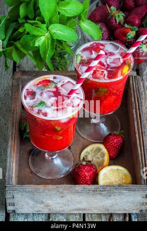 Strawberry lemonade in two glasses with straws Stock Photo