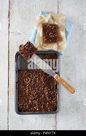 Raw chocolate brownies on a baking tray Stock Photo