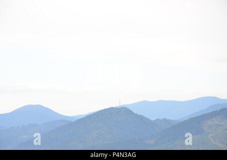 Fragment of the mountainous terrain in the Carpathians, Ukraine. The forest is forgiven by the reliefs of the Carpathian Mountains . Stock Photo