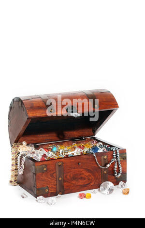 Treasure chest filled wiht precious stones and jewelry, isolated, white background Stock Photo