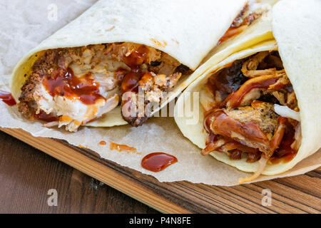 Pulled Pork Wraps with hot BBQ sauce Stock Photo