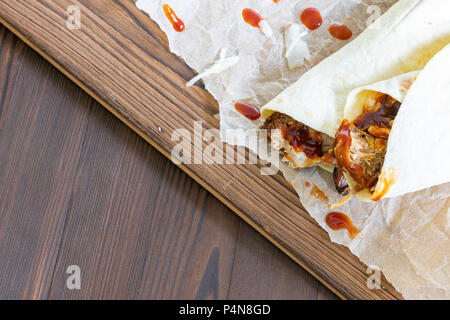 Pulled Pork Wraps with hot BBQ sauce with copy space Stock Photo