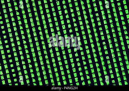 Macro shot of a glitch on the monitor of an office computer. The concept of introducing a virus into a personal data keeper. Stream of random green sy Stock Photo