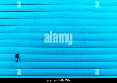 Section of turquoise wood panelling from a seaside beach hut. Perfect as a background for Summer Holiday or seaside themes. Stock Photo