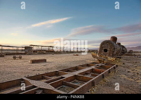 Uyuni. Low Angle View Of Blue Sky Over Old Abandoned Train At Cemetery Stock Photo