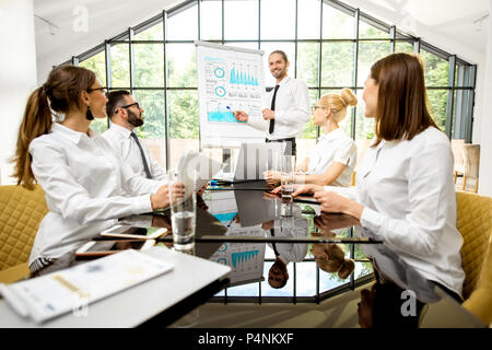 Business people during a conference indoors Stock Photo
