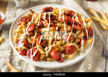 Homemade Peruvian Salchipapa Fries with Mayo Ketchup and Mustard Stock Photo