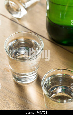 Alcoholic Clear Distilled Korean Soju in a Shot Glass Stock Photo