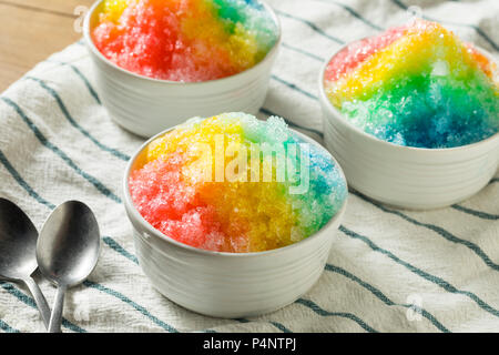 Sweet Homemade Shaved Rainbow Hawaiian Ice in a Bowl Stock Photo