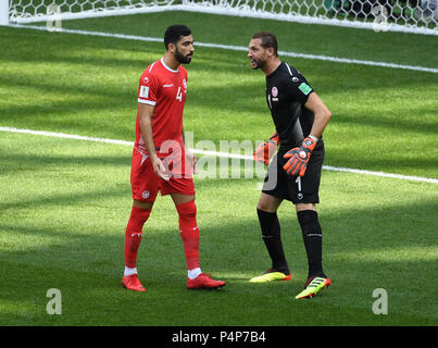 Moscow, Russia. 23rd June, 2018. Tunisia's goalkeeper Farouk Ben Mustapha (R) talks with Yassine Meriah during the 2018 FIFA World Cup Group G match between Belgium and Tunisia in Moscow, Russia, June 23, 2018. Credit: Wang Yuguo/Xinhua/Alamy Live News Stock Photo