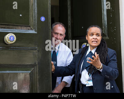London, UK. 23 June 2018. Government security guards at the Cabinet Office are angry that protesters have defaced the doors with stickers.  Remain supporters and protesters at an Anti-Brexit march and rally for a People's Vote. Photo: Bettina Strenske/Alamy Live News