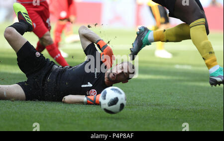 Moscow, Russia. 23rd June, 2018. Goalkeeper Farouk Ben Mustapha (bottom) of Tunisia defends during the 2018 FIFA World Cup Group G match between Belgium and Tunisia in Moscow, Russia, June 23, 2018. Credit: Xu Zijian/Xinhua/Alamy Live News Stock Photo