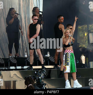 Newport, UK. 22 June 2018. Rita Ora proves her quirky sense of style in  latex bra, racing trousers and SKI goggles for powerful performance at the  Isle Of Wight Festival The singer