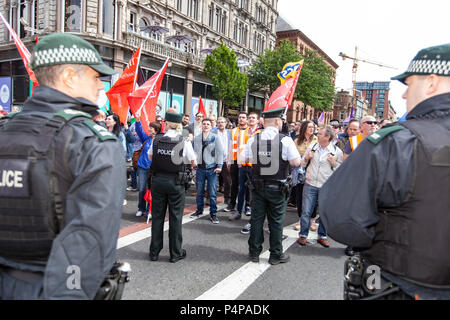 Belfast City Hall, Belfast, Northern Ireland. 23rd June 2018. Hundreds attend both UK Freedom March and a counter United Against Racism protests. there was heavy Police Presence when rival group faced each other across a police divide. Credit: Bonzo/Alamy Live News Stock Photo