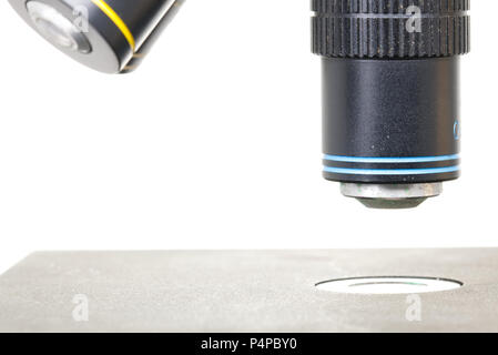 Close up of the lenses of a microscope on white background, Scientific concept for presentation template. Scientific or medical instrument Stock Photo