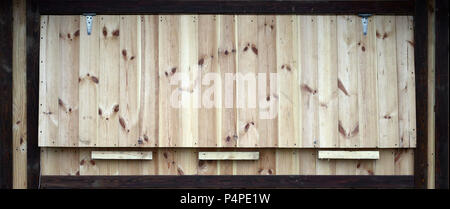 Wooden background. Texture of a wooden wall with dark and light planks. Unpainted board . Stock Photo
