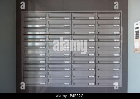 Mailboxes on the wall in the entrance of an apartment building. Stock Photo