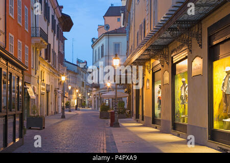 PARMA, ITALY - APRIL 18, 2018: The street of the old town at dusk. Stock Photo