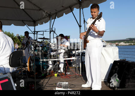 WASHINGTON, D.C. (May 11, 2012) The Navy Band Cruisers performed an evening concert at The Yards Park along the Anacostia River waterfront in Washington, DC. The Cruisers are the Navy's premier contemporary music ensemble. Stock Photo